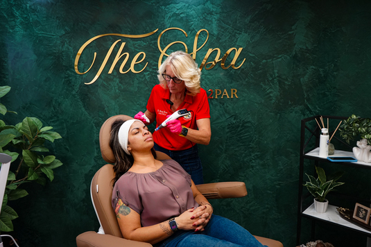 A medical provider performing an aesthetic procedure on a patient.